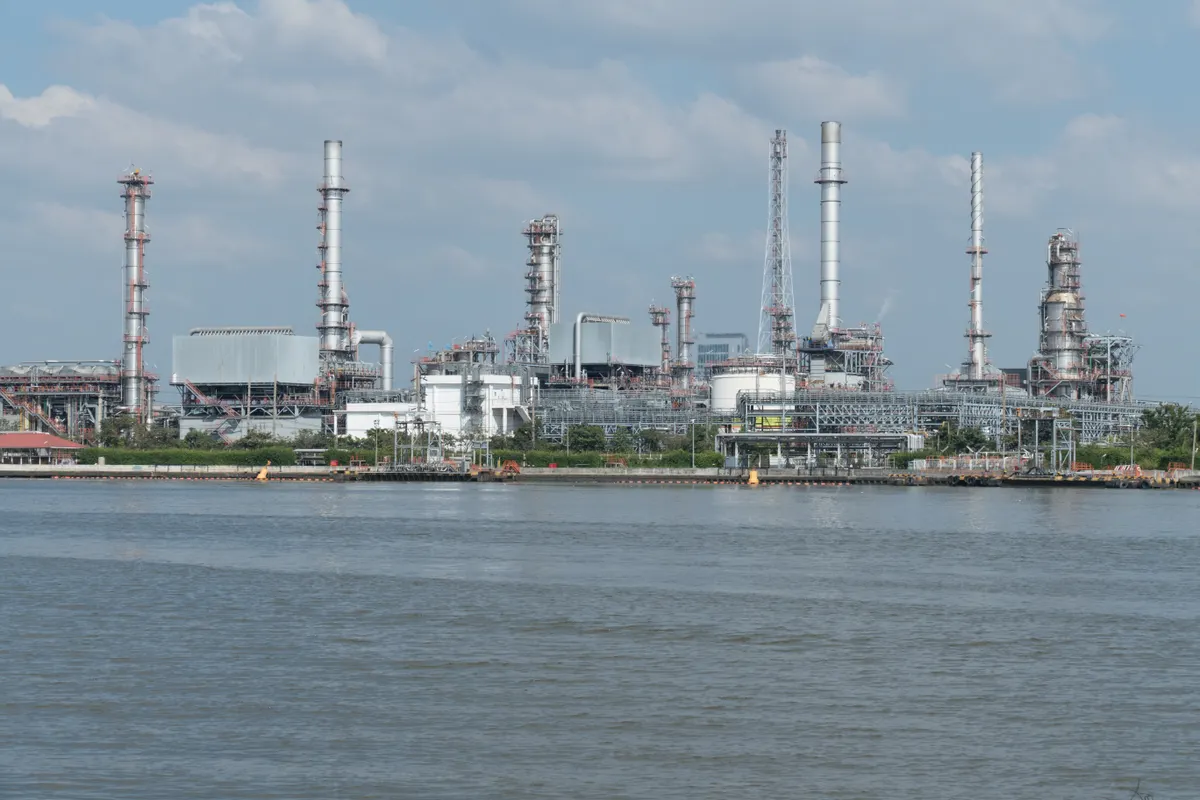 Oil refinery and industrial processing facility beside the water